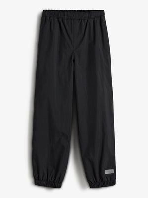 Schwarze Hose mit elastischem Bund und Beinabschlüssen, liegt flach auf weißem Hintergrund. Ein kleines graues Etikett unten rechts mit dem Text: "LINDUIS".